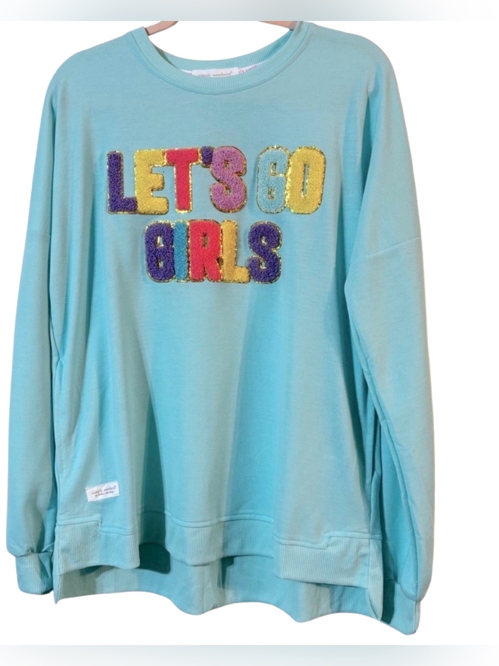 Blue sweatshirt with bold graphic design and relaxed fit